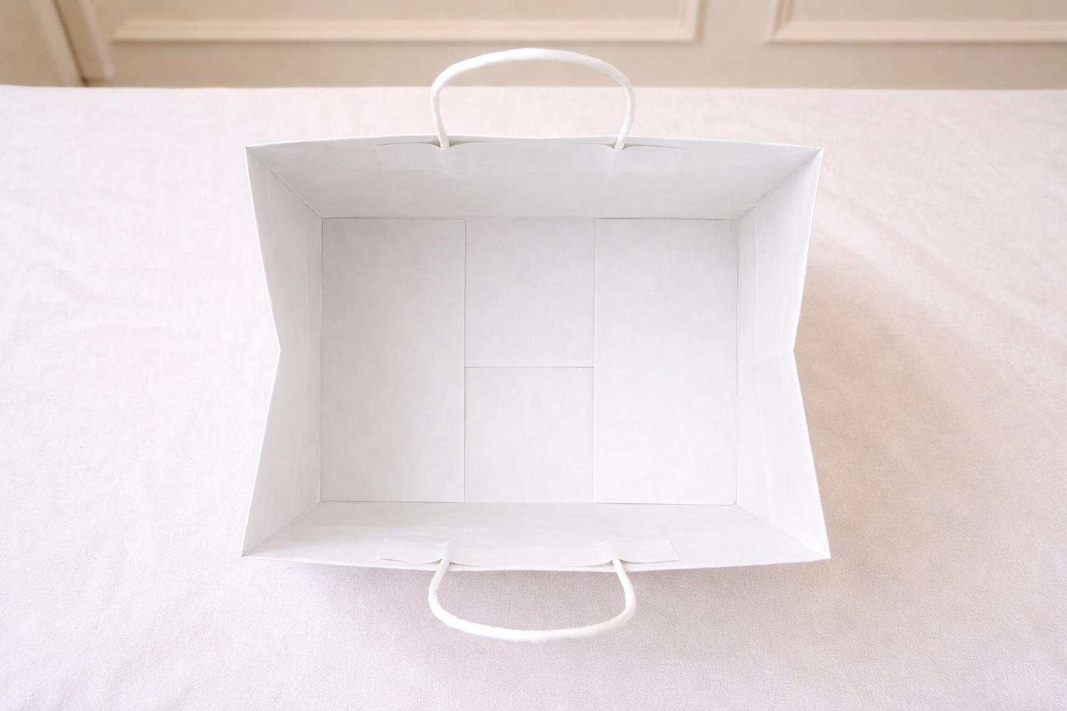 White paper bag on a white background